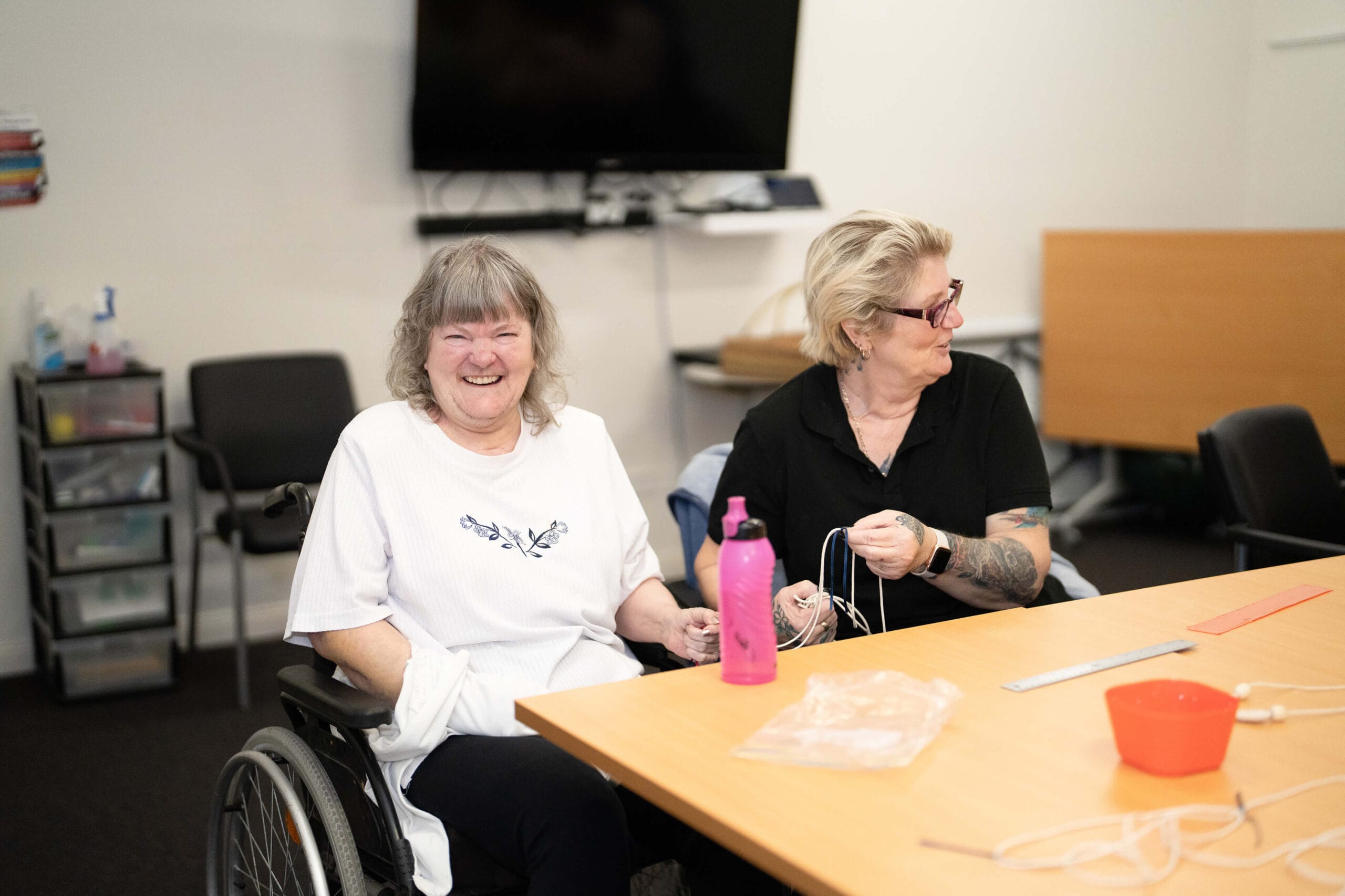 An elderly person talks to a Carers and Disability Link team member